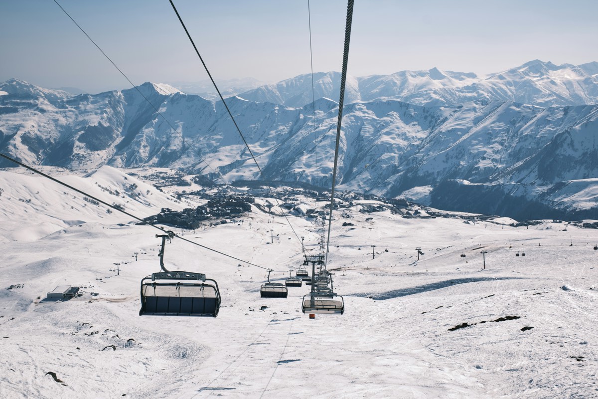 A chairlift above the snowy slopes of Gudauri, Georgia