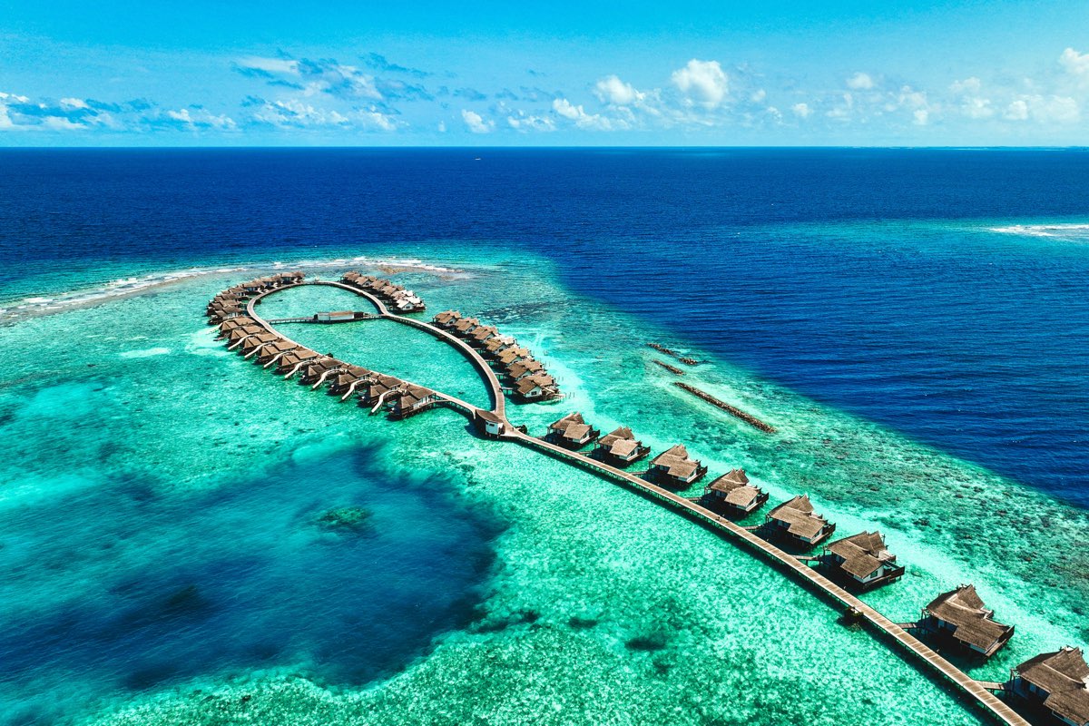 Overwater villas on a turquoise lagoon in the Maldives