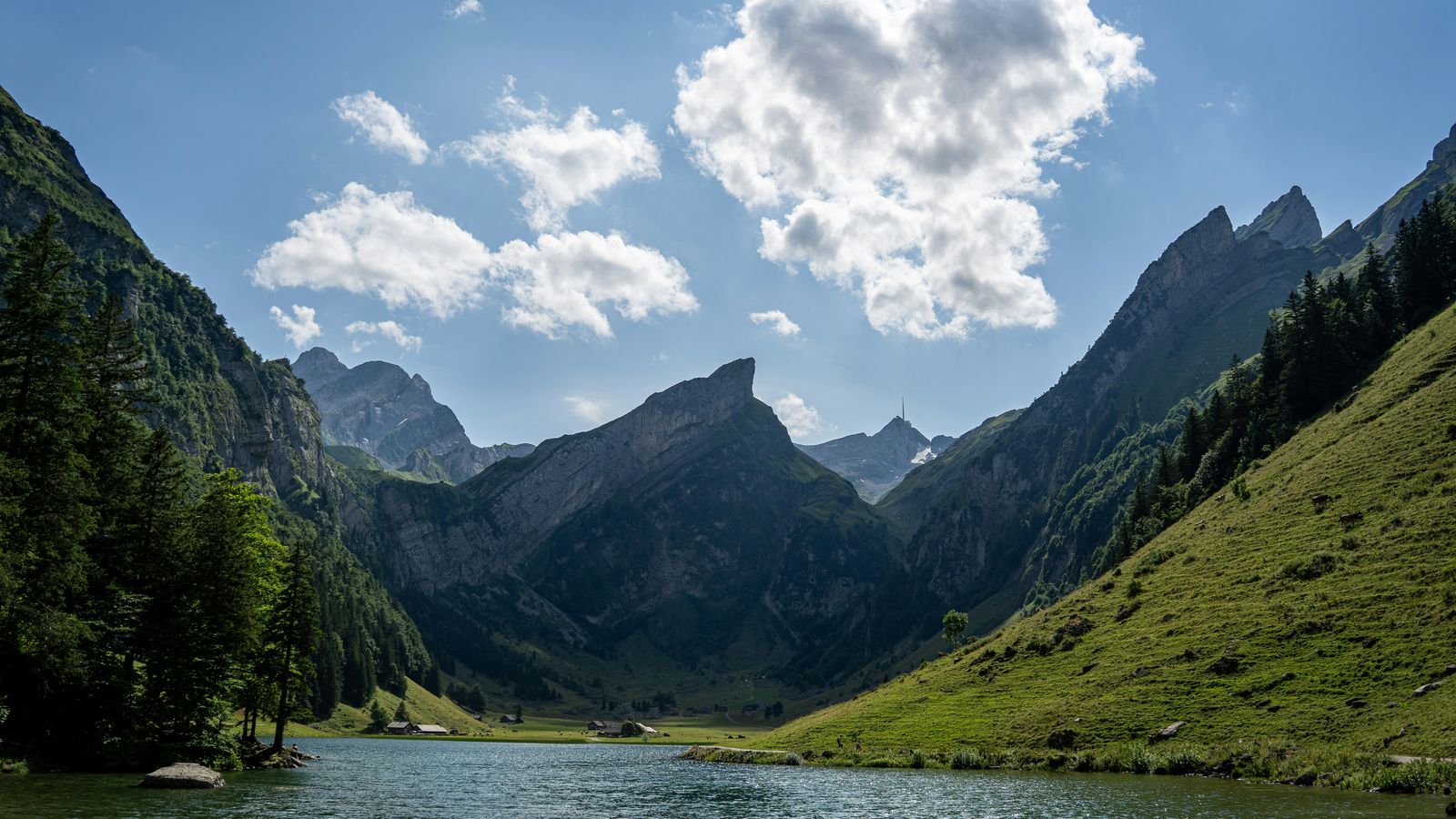 Seealpsee lake between green mountains in Appenzell, Switzerland